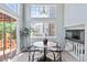 Breakfast nook with large windows, contemporary lighting, wood floors and seating for four at 19937 E Loyola Pl, Aurora, CO 80013