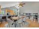 Open-concept dining area with vaulted ceilings, modern chandelier, and hardwood floors at 19937 E Loyola Pl, Aurora, CO 80013