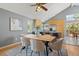 Comfortable dining area featuring wood floors, vaulted ceilings and views to the kitchen at 19937 E Loyola Pl, Aurora, CO 80013