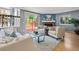 Inviting living room with a fireplace and access to the outdoor patio through sliding glass doors at 19937 E Loyola Pl, Aurora, CO 80013