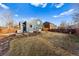 Expansive backyard with deck and spacious lawn, ideal for outdoor activities and entertaining at 11899 Elizabeth Cir, Thornton, CO 80233