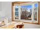 Close-up view of the bay window in the dining area, offering natural light and neighborhood views at 11899 Elizabeth Cir, Thornton, CO 80233
