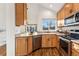 Well-appointed kitchen featuring modern appliances, granite countertops, and ample cabinet space at 11899 Elizabeth Cir, Thornton, CO 80233