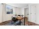 Bright office features a modern desk with sleek chair, natural light, and neutral decor at 11899 Elizabeth Cir, Thornton, CO 80233
