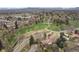 Aerial view featuring the neighborhood park and winding trails near a residential area at 8750 W 8Th Ave, Lakewood, CO 80215