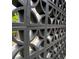 A modern concrete wall with a decorative design, providing both privacy and visual interest at 8750 W 8Th Ave, Lakewood, CO 80215