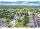 Spacious neighborhood with lush trees and community pool on a bright, sunny day at 1250 S Monaco Pkwy # 67, Denver, CO 80224