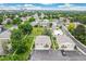 Scenic aerial view of a community featuring well-maintained homes, landscaping, and a pool at 1250 S Monaco Pkwy # 67, Denver, CO 80224
