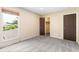 A bedroom featuring carpet, closet, walls, and window with blinds at 1250 S Monaco Pkwy # 67, Denver, CO 80224