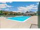 Inviting community pool with lounge chairs, pergola, and a nearby clubhouse for residents at 1250 S Monaco Pkwy # 67, Denver, CO 80224