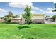 Exterior view of a charming two-story condo surrounded by a well-manicured lawn at 1250 S Monaco Pkwy # 67, Denver, CO 80224