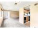 Open living room and kitchen area; neutral colors with lots of natural light at 1250 S Monaco Pkwy # 67, Denver, CO 80224