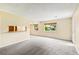 Spacious living room with natural light and an open layout; ready for personalization at 1250 S Monaco Pkwy # 67, Denver, CO 80224