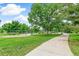 A scenic park playground offers various recreational activities in a lush, green environment at 1250 S Monaco Pkwy # 67, Denver, CO 80224