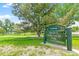 Welcome to David T. Garland Sr. Park sign with lush green trees and walking path at 1250 S Monaco Pkwy # 67, Denver, CO 80224