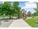 An inviting playground with unique structures and shady trees, perfect for Gathering fun and recreation at 1250 S Monaco Pkwy # 67, Denver, CO 80224