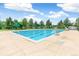 The sparkling outdoor pool has clear blue water and shaded lifeguard stands, ensuring summer fun at 1250 S Monaco Pkwy # 67, Denver, CO 80224