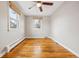 Bright bedroom with hardwood floors, two large windows and neutral walls at 2930 S Birch St, Denver, CO 80222