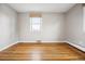 Bright bedroom with hardwood floors, neutral walls, and a large window at 2930 S Birch St, Denver, CO 80222