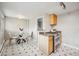 Bright kitchen area with a small dining table and stainless steel stove at 2930 S Birch St, Denver, CO 80222