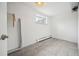 Bright laundry room with tile flooring, window, and convenient access to the outside at 2930 S Birch St, Denver, CO 80222