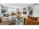 Cozy living room with a fireplace, comfortable seating, and staircase at 2930 S Birch St, Denver, CO 80222