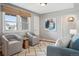 Relaxing living area featuring hardwood floors, accent chairs and windows with natural light at 2930 S Birch St, Denver, CO 80222