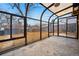 Sunroom featuring glass panels, a concrete floor, and a view of the backyard at 2930 S Birch St, Denver, CO 80222