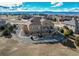 Panoramic aerial view of a home nestled within a neighborhood, featuring backyard with dual pergolas and mountain views at 3214 Timeless Trl, Berthoud, CO 80513