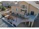 Aerial view of a lovely backyard with a dual pergola, patio and deck, surrounded by a gravel border at 3214 Timeless Trl, Berthoud, CO 80513