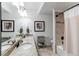 Stylish bathroom featuring double sinks, granite countertop, and a shower at 3214 Timeless Trl, Berthoud, CO 80513