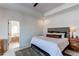 Bedroom showcasing a tray ceiling, plush rug and open door to soaking tub at 3214 Timeless Trl, Berthoud, CO 80513