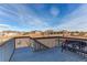 Deck view overlooking a sprawling landscape of neighboring homes and trees, perfect for enjoying the outdoors at 3214 Timeless Trl, Berthoud, CO 80513