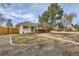 Charming single story home with a well manicured lawn and a large tree, fenced in yard at 1277 Wabash St, Denver, CO 80220