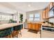 Bright kitchen featuring a butcher block bar, stainless steel appliances, and hardwood floors at 1277 Wabash St, Denver, CO 80220