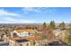 An aerial shot showing a suburban home with breathtaking mountain and city views at 14091 W Exposition Dr, Lakewood, CO 80228