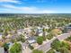 A beautiful view of the neighborhood and the city skyline in the distance from above at 14091 W Exposition Dr, Lakewood, CO 80228