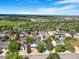 This beautiful community features mature trees, well-maintained lawns, and sidewalks, and a view of the city skyline at 14091 W Exposition Dr, Lakewood, CO 80228