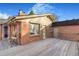 Backyard deck area featuring brick exterior at 14091 W Exposition Dr, Lakewood, CO 80228