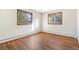 This bedroom features newer floors and windows at 14091 W Exposition Dr, Lakewood, CO 80228