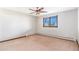 This bedroom features a ceiling fan and a window at 14091 W Exposition Dr, Lakewood, CO 80228