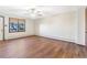 Bedroom features a ceiling fan and natural light through a window at 14091 W Exposition Dr, Lakewood, CO 80228