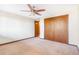 The bedroom features a ceiling fan and closet at 14091 W Exposition Dr, Lakewood, CO 80228