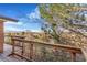 Deck view showcasing the natural surroundings and distant landscape of the property at 14091 W Exposition Dr, Lakewood, CO 80228