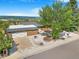 Charming brick ranch with mature landscaping, an attached garage, and spectacular mountain views at 14091 W Exposition Dr, Lakewood, CO 80228