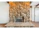 Close-up of an impressive stone fireplace, perfect for cozy evenings at 14091 W Exposition Dr, Lakewood, CO 80228