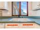Kitchen sink with views of exterior through a large window at 14091 W Exposition Dr, Lakewood, CO 80228