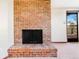 The living room features a red-brick fireplace at 14091 W Exposition Dr, Lakewood, CO 80228