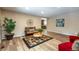 Comfortable living room showcasing wood floors, neutral walls, and stylish decor at 17720 Canterbury Dr, Monument, CO 80132