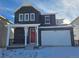 Charming two-story home boasts a modern design, complemented by a bright red door and a spacious two car garage at 8820 Whiteclover St, Littleton, CO 80125